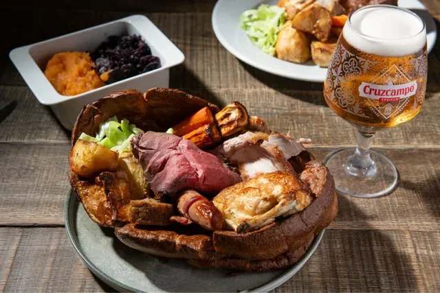 The Village Roast: beef, pork and chicken in a giant Yorkshire pudding